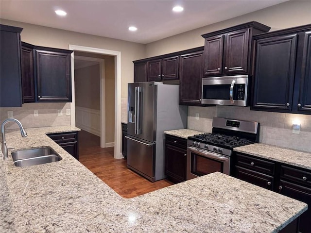 3622 Foxtrot Trl NW, Kennesaw, GA 30144 - kitchen with stainless steel appliances, a sink, wood finished floors, decorative backsplash, and recessed lighting