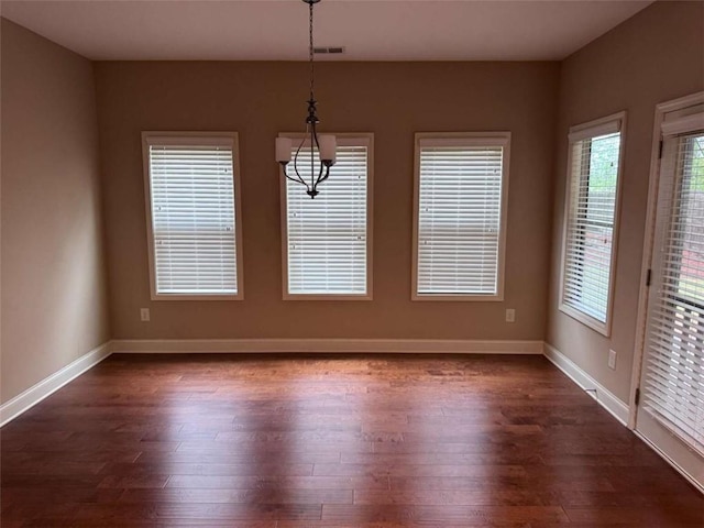 3622 Foxtrot Trl NW, Kennesaw, GA 30144 - unfurnished dining area featuring dark wood finished floors, plenty of natural light, and baseboards