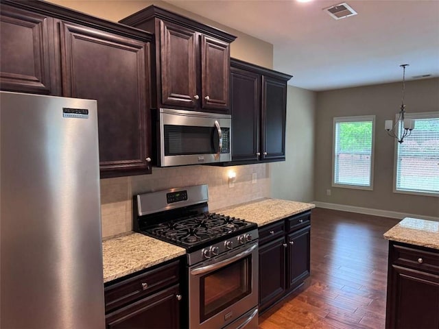 3622 Foxtrot Trl NW, Kennesaw, GA 30144 - kitchen featuring appliances with stainless steel finishes, tasteful backsplash, wood finished floors, and baseboards