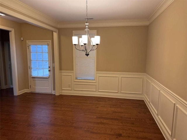 3622 Foxtrot Trl NW, Kennesaw, GA 30144 - unfurnished dining area with a chandelier, dark wood finished floors, ornamental molding, wainscoting, and a decorative wall