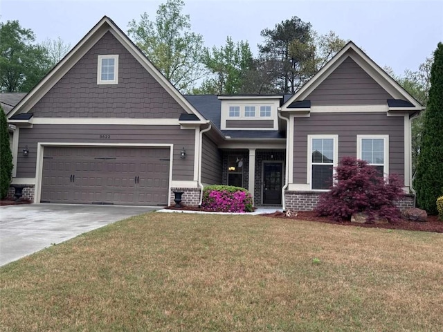 3622 Foxtrot Trl NW, Kennesaw, GA 30144 - craftsman inspired home featuring driveway, a front yard, an attached garage, a porch, and brick siding