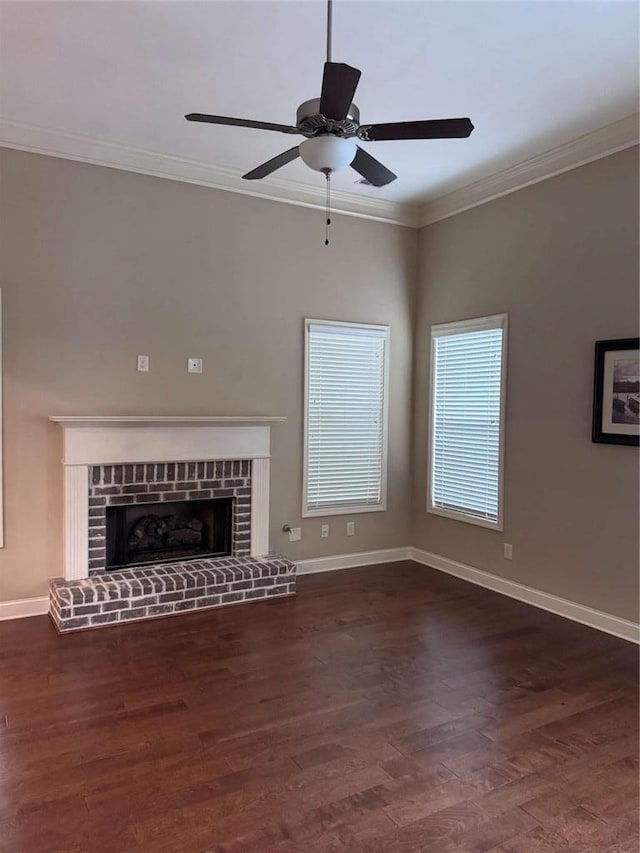 3622 Foxtrot Trl NW, Kennesaw, GA 30144 - unfurnished living room featuring wood finished floors, crown molding, baseboards, a ceiling fan, and a brick fireplace