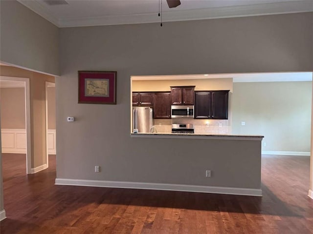 3622 Foxtrot Trl NW, Kennesaw, GA 30144 - kitchen featuring appliances with stainless steel finishes, ornamental molding, ceiling fan, dark wood finished floors, and dark brown cabinetry
