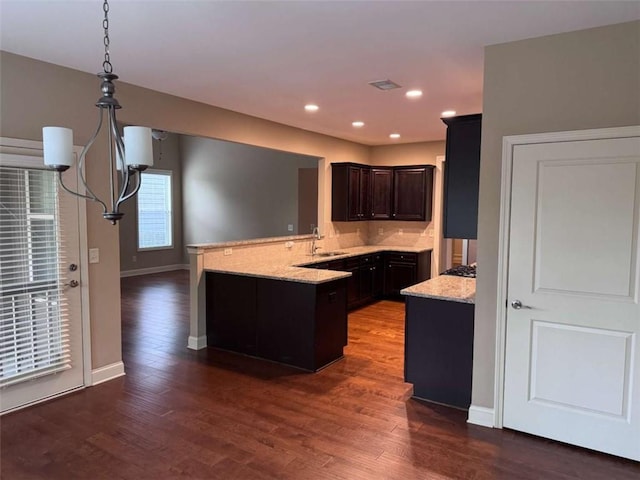 3622 Foxtrot Trl NW, Kennesaw, GA 30144 - kitchen featuring a peninsula, dark wood-type flooring, a sink, baseboards, and recessed lighting