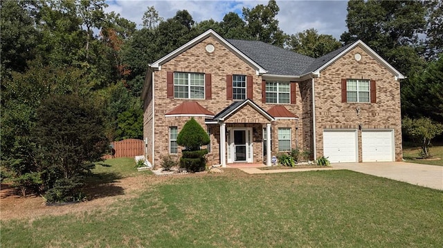 front facade with a garage and a front lawn