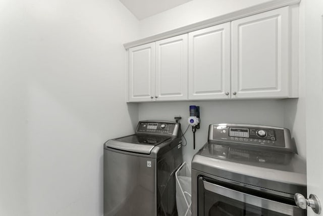 1227 Parkside Village Dr NW, Marietta, GA 30060 - laundry room featuring independent washer and dryer and cabinet space