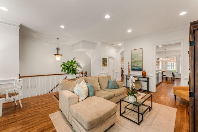 1227 Parkside Village Dr NW, Marietta, GA 30060 - living area featuring crown molding, light wood-style flooring, recessed lighting, a chandelier, and wainscoting