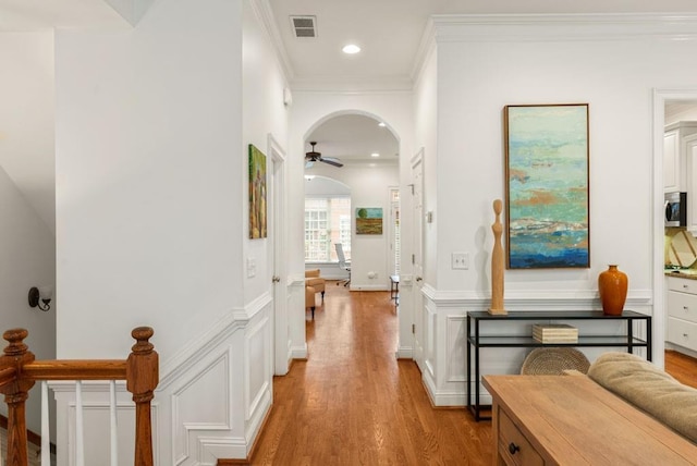 1227 Parkside Village Dr NW, Marietta, GA 30060 - corridor with ornamental molding, light wood-style flooring, arched walkways, recessed lighting, and a wainscoted wall