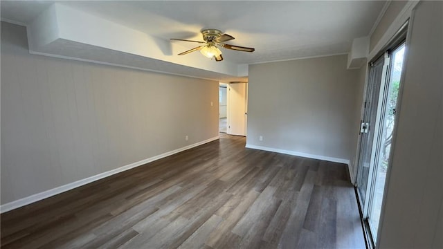 empty room featuring ceiling fan and dark hardwood / wood-style flooring