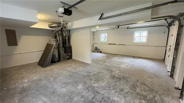 garage featuring electric panel and a garage door opener