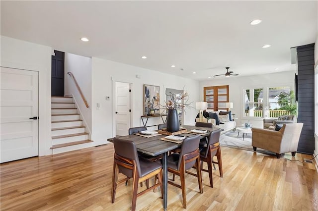 dining room featuring light hardwood / wood-style floors and ceiling fan