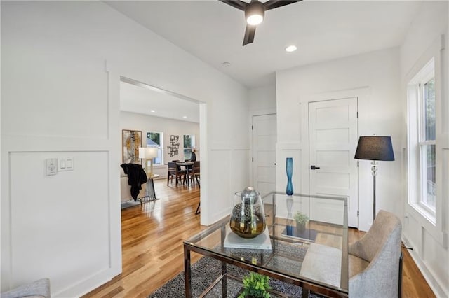 interior space with hardwood / wood-style floors and ceiling fan