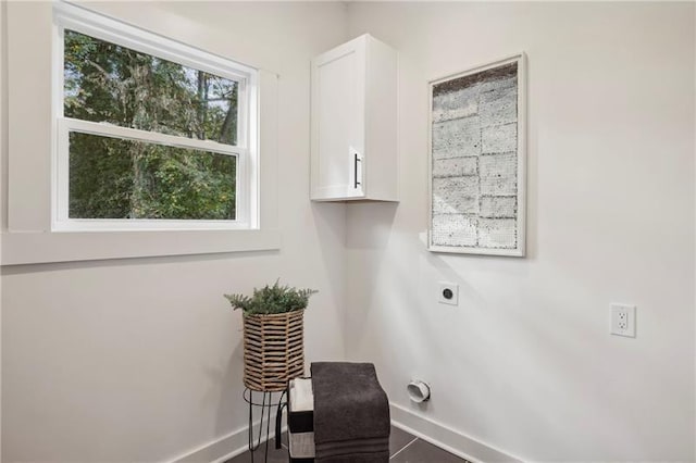 laundry area featuring cabinets and electric dryer hookup