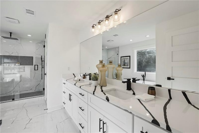 bathroom with walk in shower and vanity