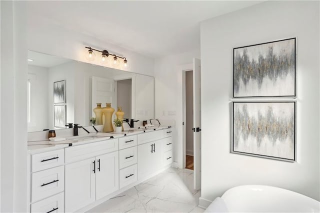 bathroom with vanity and a bath