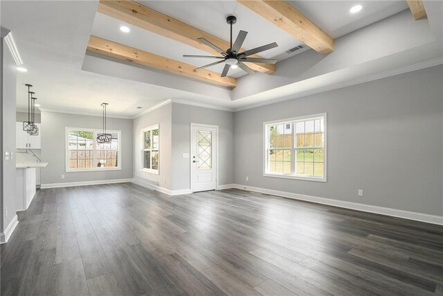 unfurnished living room with beam ceiling, dark hardwood / wood-style flooring, ceiling fan, and crown molding