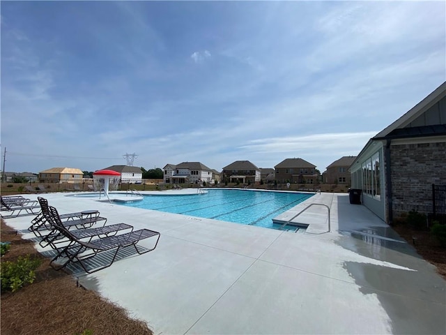 view of swimming pool with a patio area