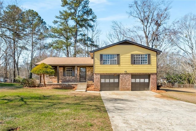 split level home featuring a garage and a front lawn