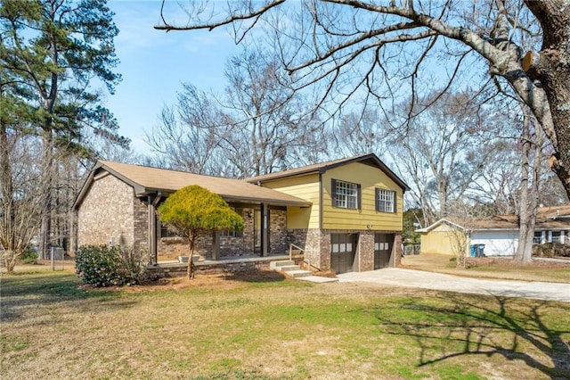 tri-level home featuring a garage and a front yard