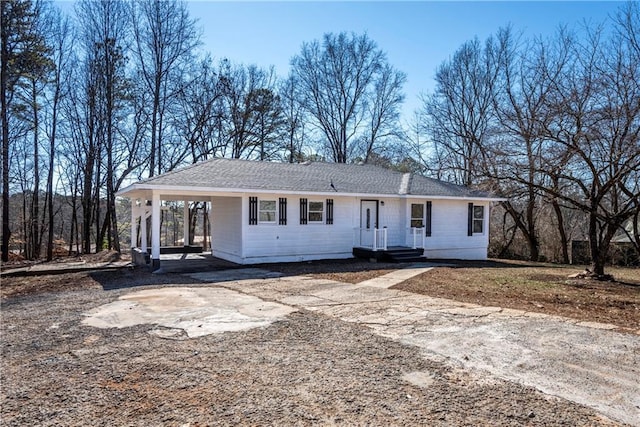 view of front of property featuring a carport