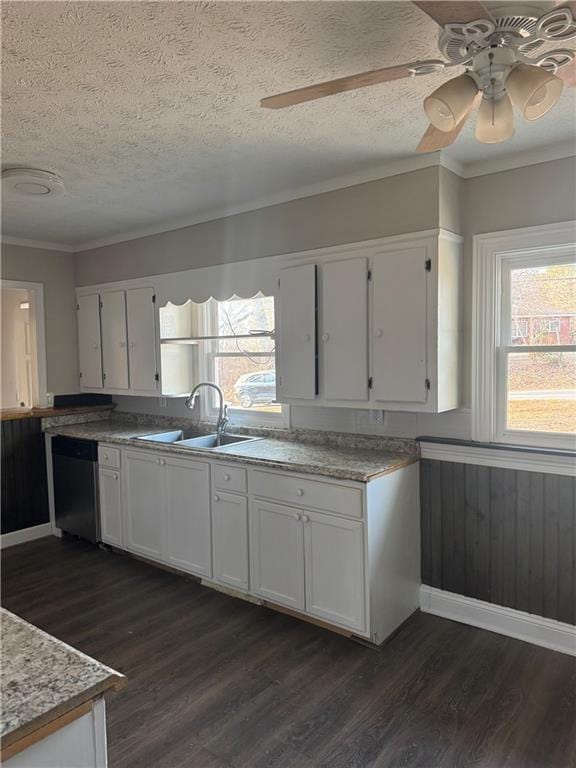 kitchen with dishwasher, sink, white cabinets, dark wood-type flooring, and a textured ceiling