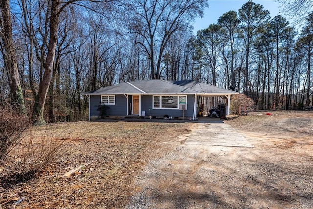 single story home with a carport