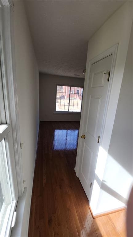 hall featuring dark wood finished floors