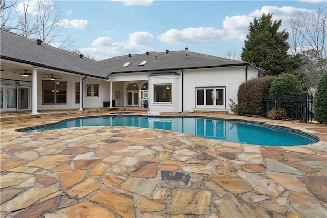 view of pool with a patio, ceiling fan, and french doors