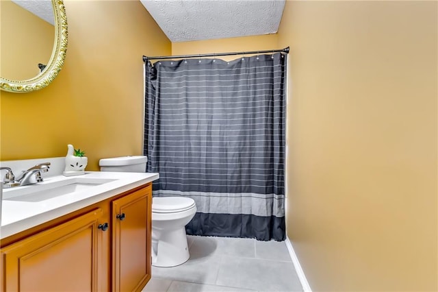 bathroom featuring toilet, tile patterned flooring, vanity, and a textured ceiling