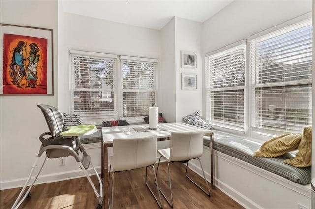 dining room with dark hardwood / wood-style floors