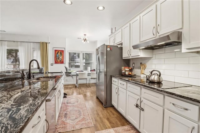 kitchen with white cabinets, stainless steel appliances, and sink