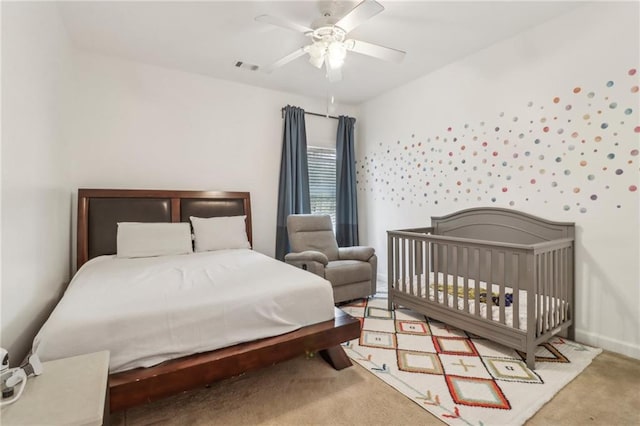 carpeted bedroom with ceiling fan