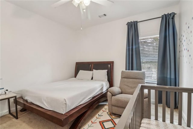 bedroom featuring ceiling fan and light carpet