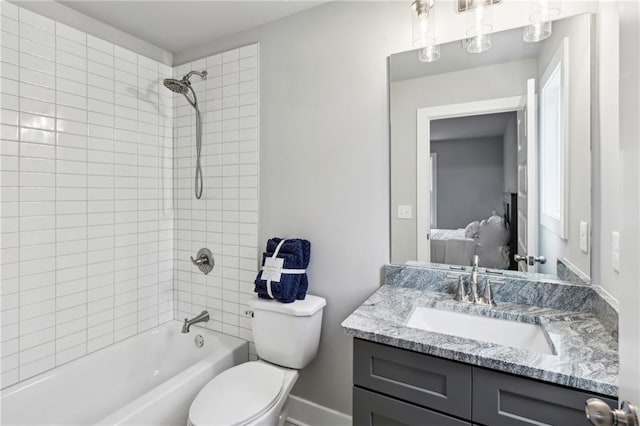 ensuite bathroom featuring vanity,  shower combination, toilet, and ensuite bathroom