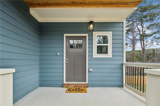 doorway to property with covered porch