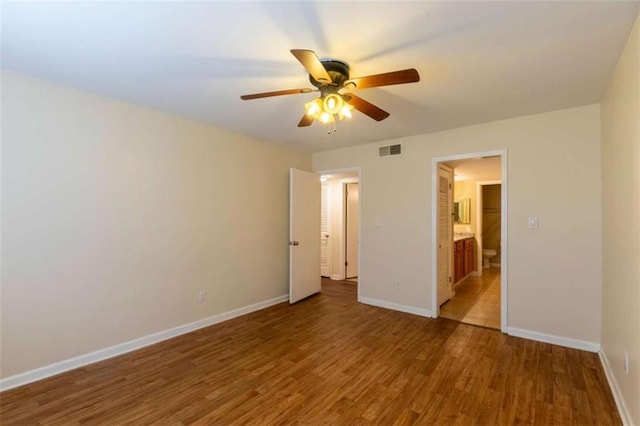 177 NW Amherst Pl, Atlanta, GA 30327 - unfurnished bedroom with ensuite bathroom, visible vents, baseboards, ceiling fan, and wood finished floors