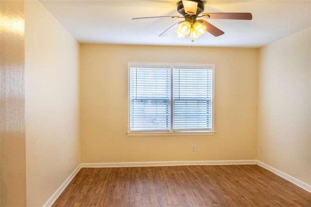 177 NW Amherst Pl, Atlanta, GA 30327 - unfurnished room with baseboards, wood finished floors, and a ceiling fan