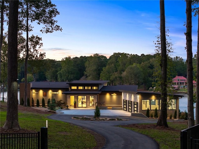 view of back house at dusk