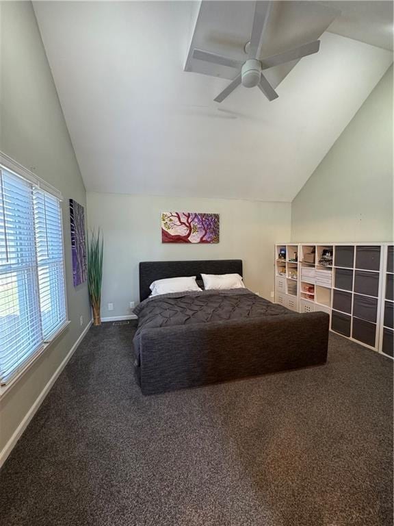 bedroom with a ceiling fan, baseboards, vaulted ceiling, and carpet flooring