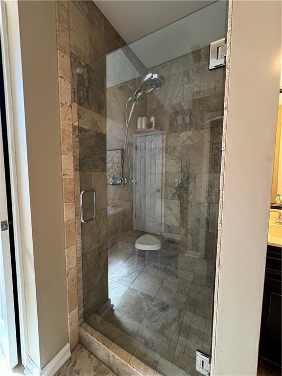 full bath featuring a shower stall