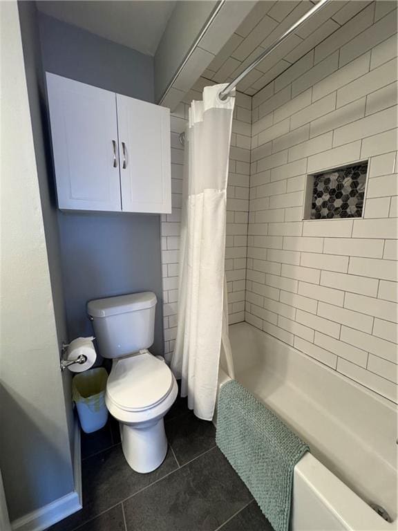 full bathroom featuring toilet and tile patterned floors