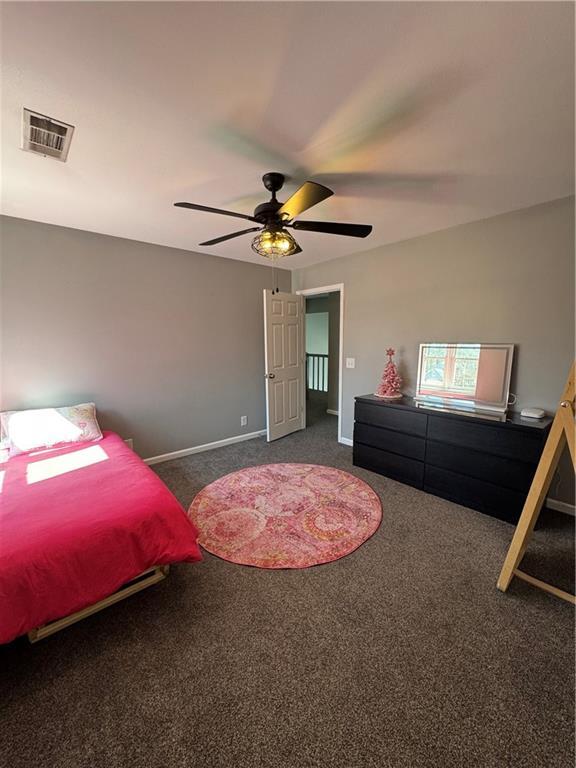 bedroom featuring carpet, visible vents, ceiling fan, and baseboards