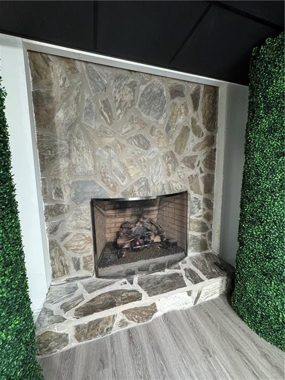 interior details with an outdoor stone fireplace