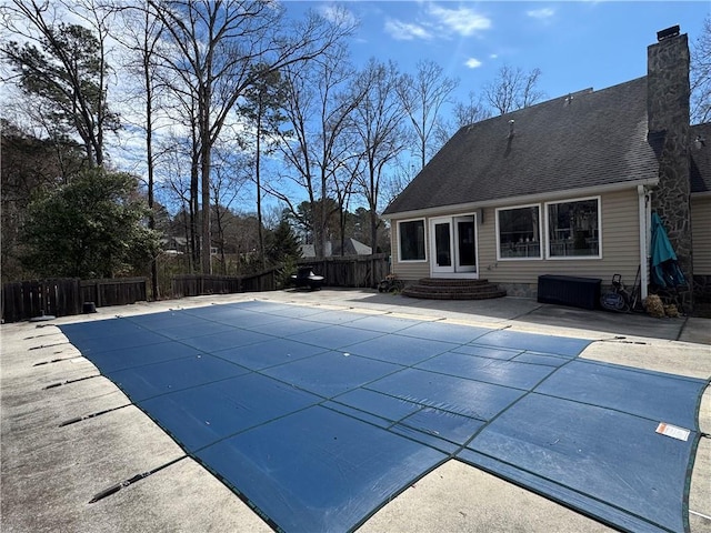 view of pool featuring entry steps, a patio, fence, and a fenced in pool