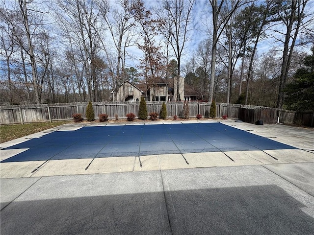 view of swimming pool with a patio area, a fenced backyard, and a fenced in pool