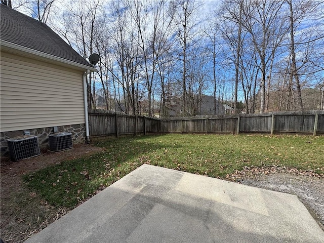 view of yard with a patio area, a fenced backyard, and cooling unit