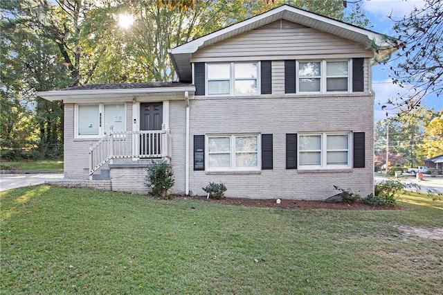 tri-level home with a front lawn