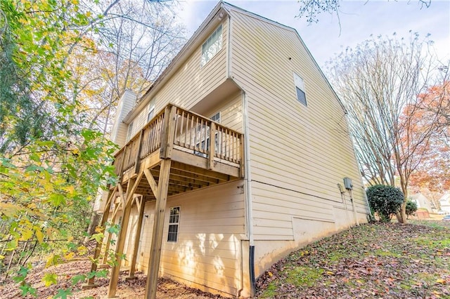 view of side of property with a deck