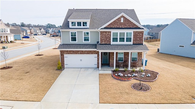 view of front of property with a garage and covered porch