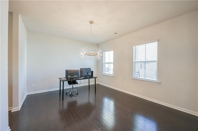 office featuring dark hardwood / wood-style floors and a notable chandelier